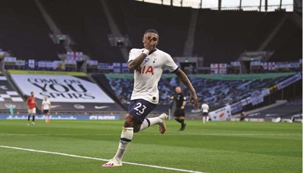 Tottenham Hotspuru2019s Dutch midfielder Steven Bergwijn celebrates scoring the opening goal against Manchester United at Tottenham Hotspur Stadium in London yesterday.