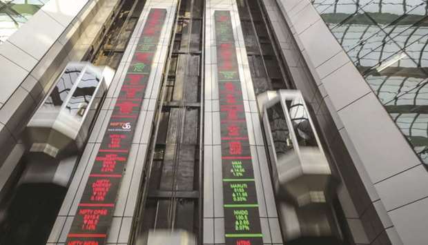 Elevators travel next to electronic boards displaying stock figures at the National Stock Exchange of India building in Mumbai. The Sensex closed at 33,303.52, up 879.42 points or 2.71% and the Nifty was at 9,826.15, up 245.85 points or 2.57% yesterday, marking their longest winning streak since April 30.
