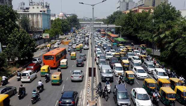 Vehicles seen on a road after some restrictions were lifted in New Delhi yesterday.