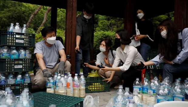 Park Jung-oh, head of North Korean defector group Kuensaem, speaks to members of the media during preparations to send plastic bottles filled with rice and masks towards the North, in Seoul, South Korea on June 18