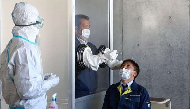 Japan allows saliva-based tests to boost coronavirus detection