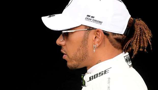 In this March 12, 2020, picture, Mercedesu2019 Lewis Hamilton poses for a drivers portrait at the Melbourne Grand Prix Circuit in Australia. (Reuters)