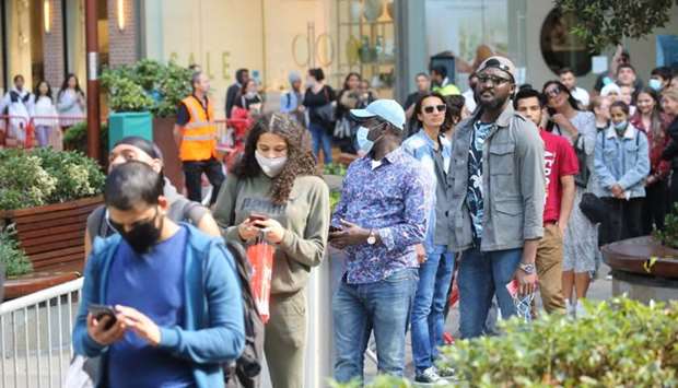 Shoppers queue at Westfield shopping centre in east London