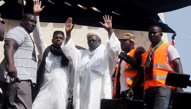 Imam Mahmoud Dicko greets supporters during a protest on Friday, demanding the resignation of Maliu2019s President Ibrahim Boubacar Keita, at Independence Square in Bamako.