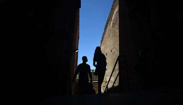 Visitors are seen at the Colosseum, which reopened to the public yesterday after having been closed since March 8.