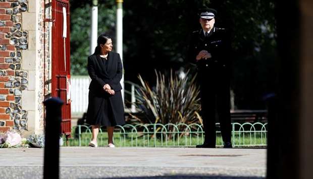 Britain's Home Secretary Priti Patel and Thames Valley Police Chief Constable, John Campbell are pictured near to the scene of reported multiple stabbings in Reading