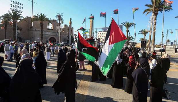 Women and children wave flags of Libya and Palestine in the Martyrsu2019 Square in the centre of the Libyan capital Tripoli, currently held by the UN-recognised Government of National Accord (GNA), yesterday.