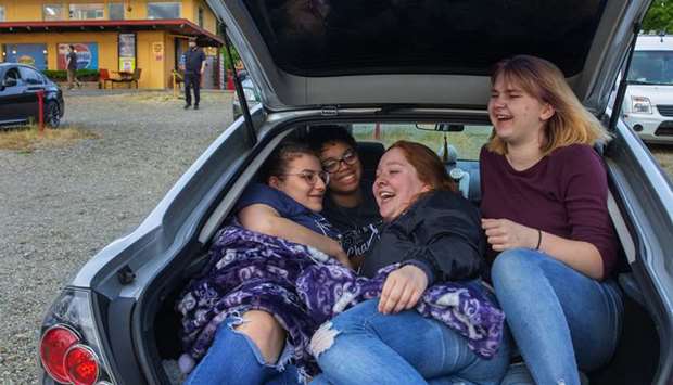 FUN: From left, friends Aliyah Tageant, Issabella Gilford, Jessica Murray and Patricia Bates enjoy some time in their car before the start of the movie at Skyline Drive-In.