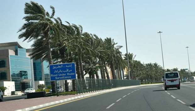 Tree branches swaying in the wind on a Doha road on Monday. PICTURE: Ram Chand