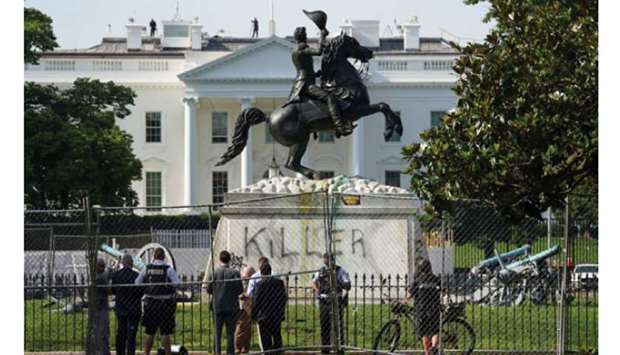 Graffiti is daubed on the statue of Andrew Jackson near the White House in Washington, DC.
