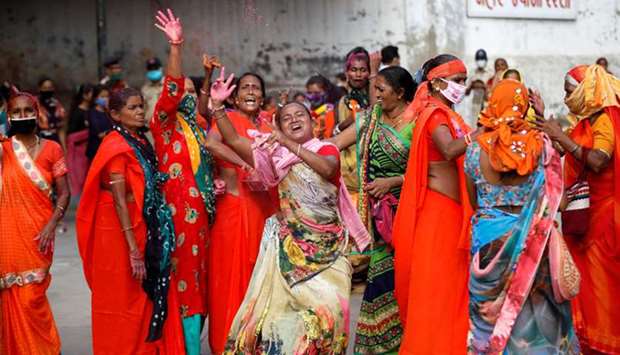 Women dance as they arrive to attend the annual Rath Yatra in Ahmedabad yesterday.