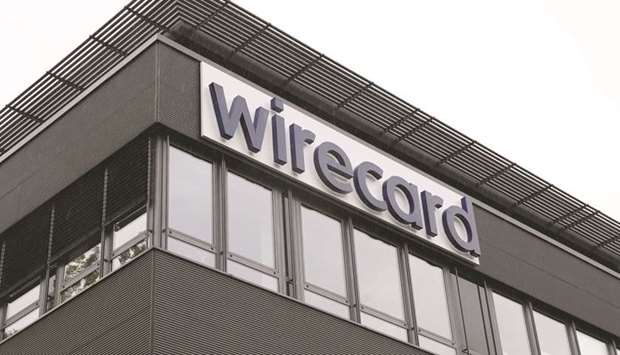 A sign hangs outside the Wirecard headquarters in the Aschheim district of Munich. Philippine Justice Secretary Menardo Guevarra said yesterday that he had instructed state investigators to co-ordinate with the central banku2019s anti-money laundering council in investigating Wirecard.