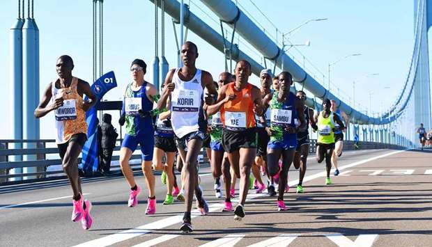 In this November 3, 2019, picture, runners cross the Verrazzano-Narrows Bridge during the 2019 New York City Marathon. (AFP)