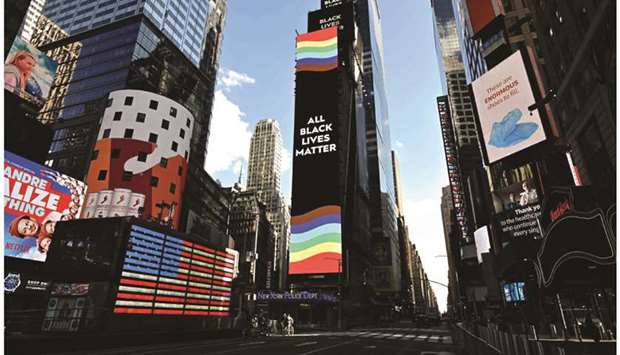 An u2018All Black Lives Matteru2019 sign is pictured on an advertising board at Times Square in New York City.