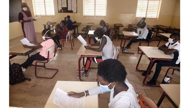 Pupils wearing face masks attend a class in Dakar yesterday.