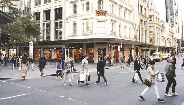 Pedestrians and shoppers cross a road at Pitt Street Mall in Sydney. One of Australiau2019s largest pension funds plans to boost investments in private debt, concerned that stocks have rallied too far too fast and traditional bonds are offering meagre returns.
