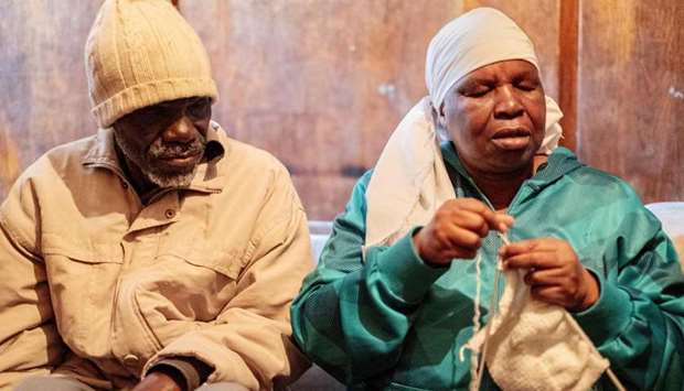 Enok Mukanhairi (left), 57, a blind person from Zimbabwe, and his blind wife Angeline Tazira, 50, sit in their room in the Johannesburg CBD.