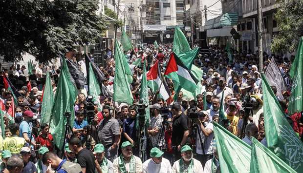 Palestinian Hamas supporters take part in a protest against Israelu2019s plan to annex parts of the occupied West Bank, in Khan Yunis in the southern Gaza Strip, yesterday.