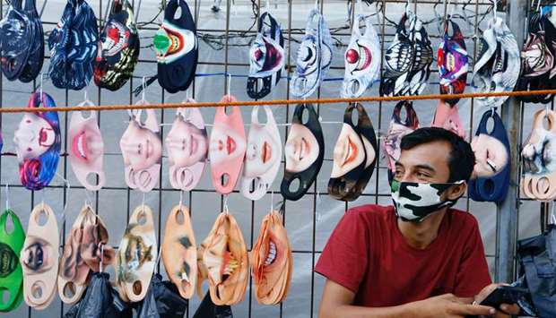 A vendor sits near a face design masks display at a traditional market, amid the coronavirus disease (Covid-19) outbreak, in Jakarta yesterday.