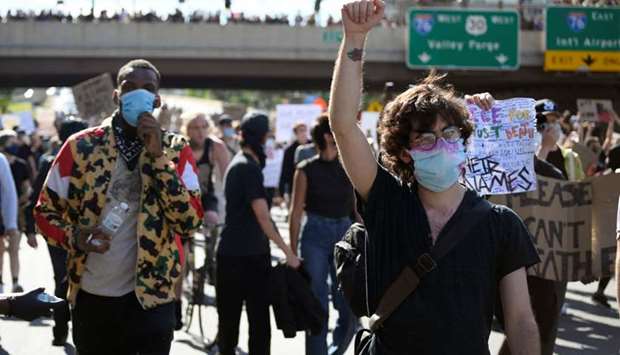 Protesters block traffic and march eastbound on the I-676, Vine Street Expressway during a rally against the death in Minneapolis police custody of George Floyd, in Philadelphia, Pennsylvania, US, on June 1.