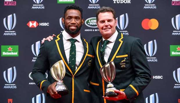 Springboks captain Siya Kolisi (left) and coach Rassie Erasmus pose at the 2019 Rugby World Cup awards ceremony in Tokyo. (AFP)