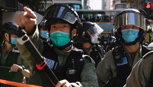 Riot police ask people to leave to avoid mass gathering during a protest against the looming national security legislation in Hong Kong, China