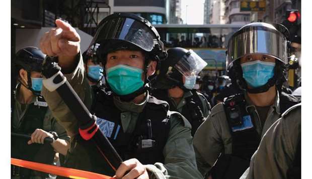 Riot police ask people to leave to avoid mass gathering during a protest against the looming national security legislation in Hong Kong yesterday.