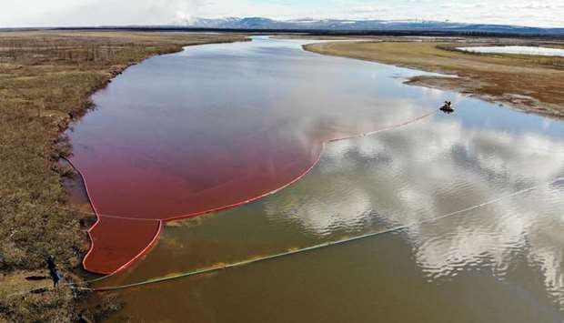 This handout photograph taken and released by the Marine Rescue Service of Russia earlier this month shows the large diesel spill in the Ambarnaya River, outside Norilsk.