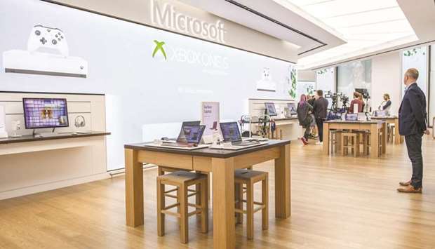 A Microsoft Corporation store in central in London. The move to close its physical store locations permanently will result in a pretax charge of about $450mn, or 5 cents a share, in the current quarter, Microsoft said in a statement.