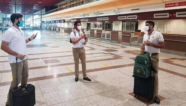 Pakistan players Babar Azam (right), Imad Wasim (left) and Imam-ul-Haq at the Allama Iqbal International Airport in Lahore before their departure to England yesterday. (AFP)
