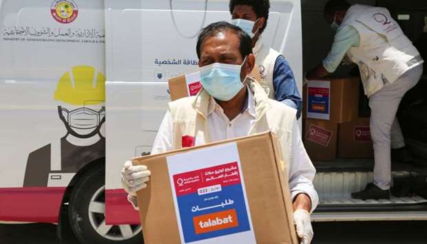 QC, in co-operation with Talabat, distributed the food parcels to workers and families affected by the Covid-19 pandemic in Ain Khalid, Al Muntazah and Al Wakra.