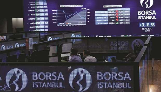 Traders work at their desks on the floor of the Borsa Istanbul in Istanbul (file). Turkey banned short selling on banking stocks in October.