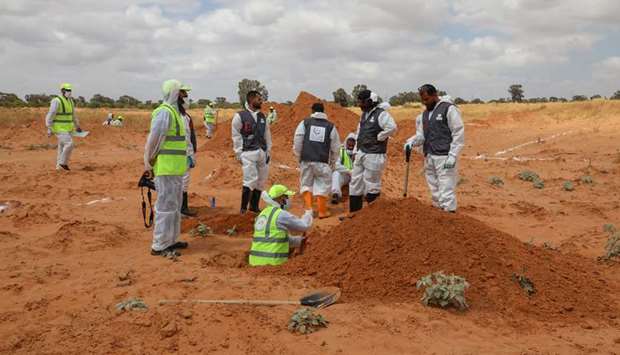 Members of the Government of National Accordu2019s (GNAu2019s) missing persons bureau search for human remains in what Libyau2019s internationally recognised government officials say is a mass grave, in Tarhuna city.