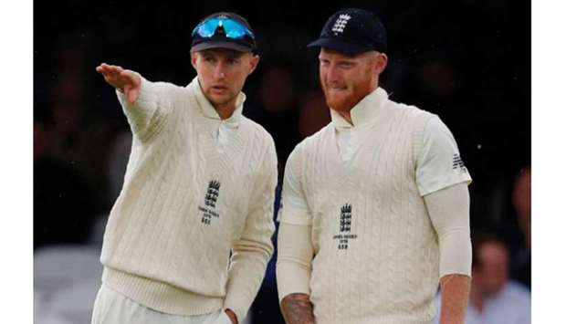 Ben Stokes (right) is set to captain England for the first time after it was confirmed that regular skipper Joe Root would miss the series opener against the West Indies to be with his wife Carrie, who is expecting the coupleu2019s second child later this week. (AFP)