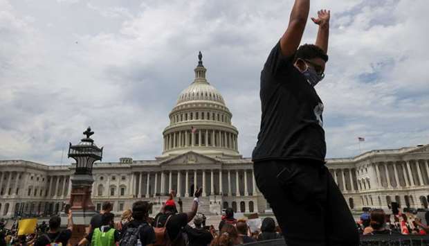 A Black Lives Matter protester takes part in a rally, as protests continue over the death in Minneapolis police custody of George Floyd, outside the US Capitol in Washington.