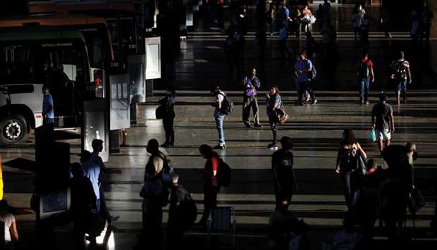 People maintain social distancing while waiting at the central bus station in Brasilia amid the coronavirus outbreak in Brasilia, Brazil.