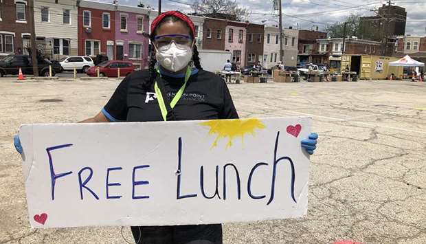 ANNOUNCEMENT: Rosalind Pichardo advertises a daily food giveaway service in the heart of Philadelphiau2019s Kensington neighbourhood, where more people die of drug overdoses than in any other area in the city.
