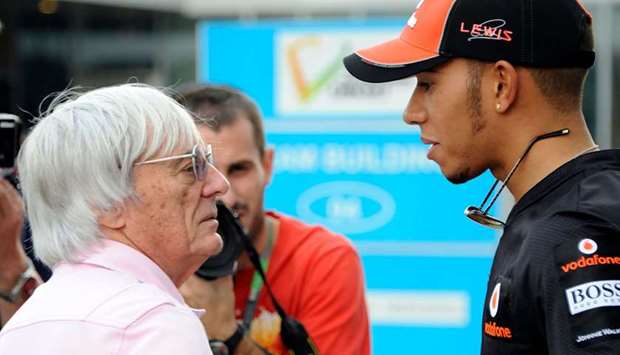Lewis Hamilton (right) with Bernie Ecclestone. (AFP)