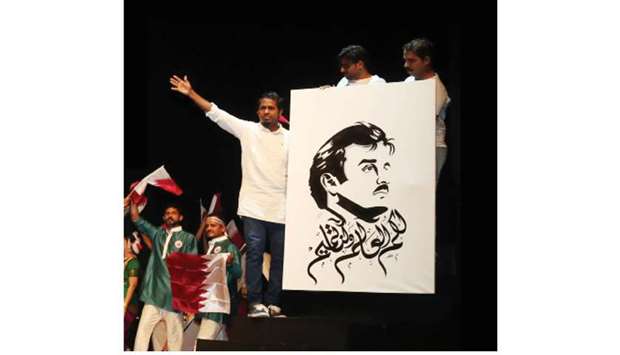 LIVE PORTRAIT: Kareemgraphy after completing a portrait of His Highness the Amir Sheikh Tamim bin Hamad al-Thani at an event.