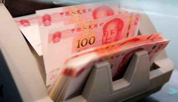 Chinese 100 yuan banknotes are seen in a counting machine at a branch of a commercial bank in Beijing (file). When the offshore yuan matched its record low last week, it served notice that Chinau2019s exchange-rate fixing had returned as a key variable to participants in the $6.5tn-a-day global foreign-exchange market.