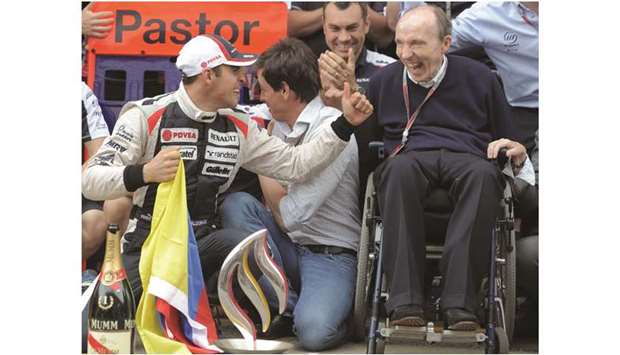 In this May 13, 2012, picture, Williamsu2019 driver Pastor Maldonado and team principal Frank Williams (right) celebrate with team members after his win in the Spanish Grand Prix at the Circuit de Catalunya in Montmelo on the outskirts of Barcelona, Spain. (AFP)