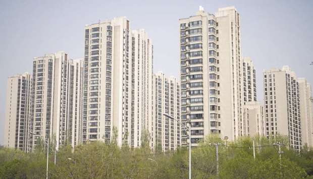 Residential buildings stand in the Taiyanggong area of Beijing. China kicked off a REIT trial in late April that will initially focus around pooling capital to fund infrastructure projects like highways and airports.