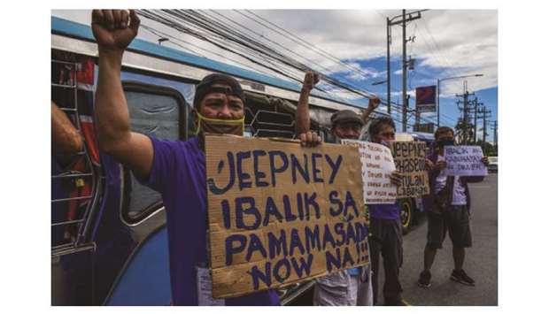 Drivers of jeepney, a popular public transport, chant slogans during a protest in Quezon city in the Metro Manila area recently, calling on the government to let them return to work.