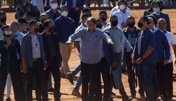 President Jair Bolsonaro gestures after the inauguration ceremony of a temporary field hospital, amid the coronavirus outbreak, in Aguas Lindas de Goias, state of Goias Brazil, yesterday.