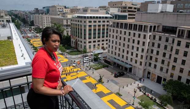 Mayor Muriel Bowser looks out over a Black Lives Matter sign that was painted on a street, during nationwide protests against the death in Minneapolis police custody of George Floyd, in Washington, DC