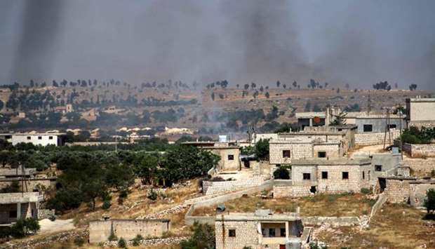 Smoke plumes rising following shelling by pro-Syrian government forces in the town of Banin, north of Maaret al-Numan in Syria's northwestern Idlib province. on June 4.