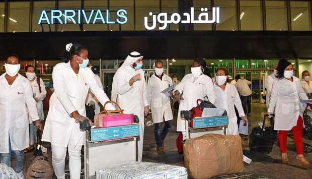 A delegation of Cuban medical personnel arrives at Kuwait International Airport early yesterday, to assist the countryu2019s effort in the fight against Covid-19.