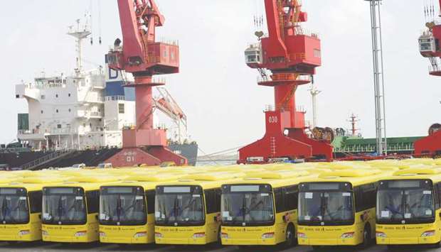 Buses wait to be exported in Lianyungang port. Chinau2019s overseas shipments in May fell 3.3% from a year earlier, after a surprising 3.5% gain in April, customs data showed yesterday.