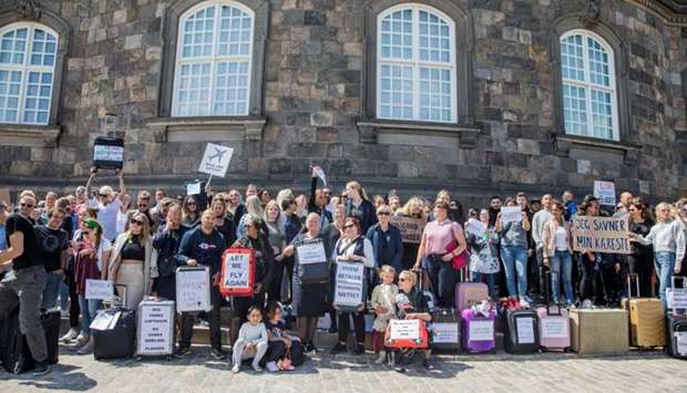 People from the Danish airline industry demonstrate in favor of opening the country's boarders more in front of the Parliament building Christiansborg, in Copenhagen, Denmark