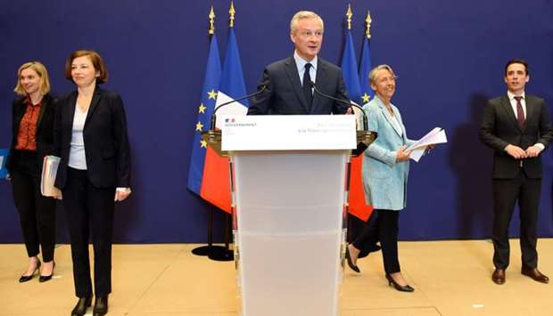 French Economy and Finance Minister Bruno Le Maire (C), accompanied by (LtoR) French Junior Minister for Economy and Finance Agnes Pannier-Runacher, French Defence Minister Florence Parly, French Minister for the Ecological and Inclusive Transition Elisabeth Borne and French Junior Minister for Transports Jean-Baptiste Djebbari, addresses a press conference on the French government's plan for the support of the hard-hit aviation industry, in Paris